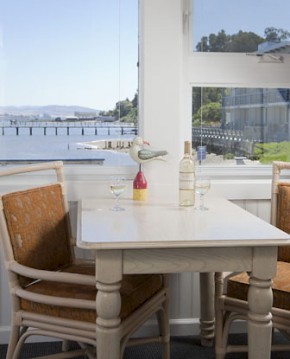 Dining table with wine for two with view of the bay